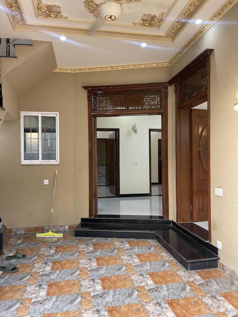 5 Marla Triple Story House for Sale with 7 Bedrooms Near Emporium Mall and Canal Road 1