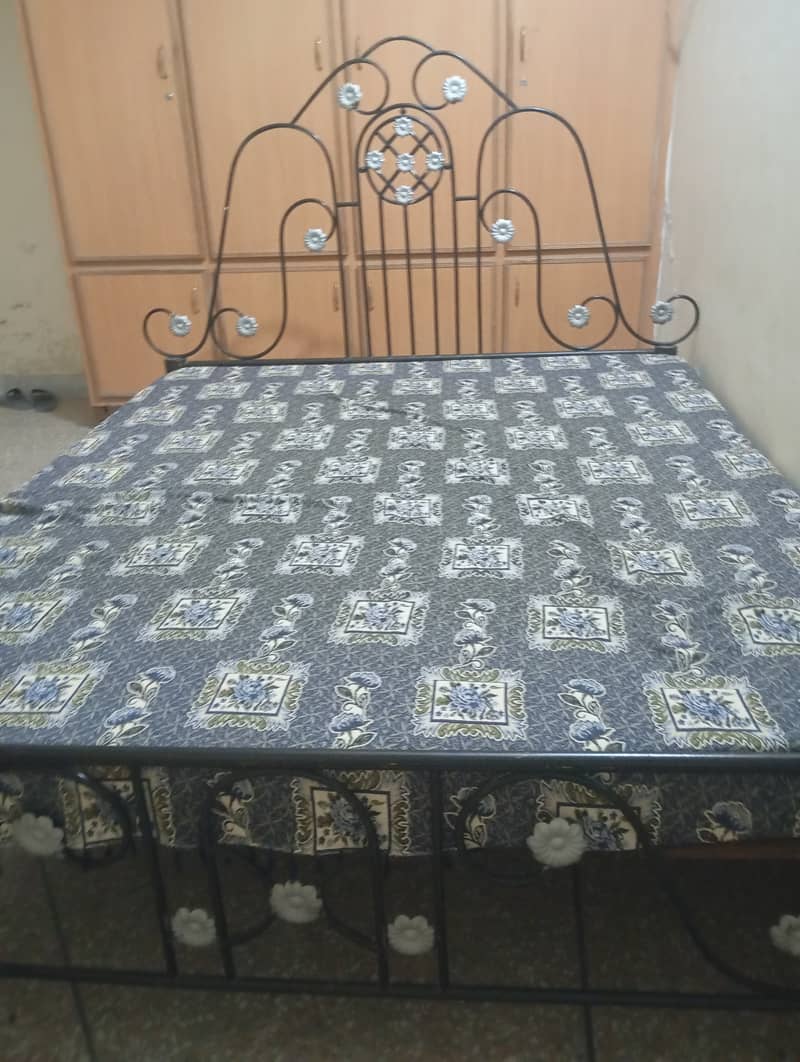 Iron double bed with mattress 0