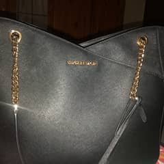 selling only slightly used micheal kors bag very classy