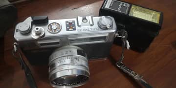 Vintage Yashica camera with flashgun