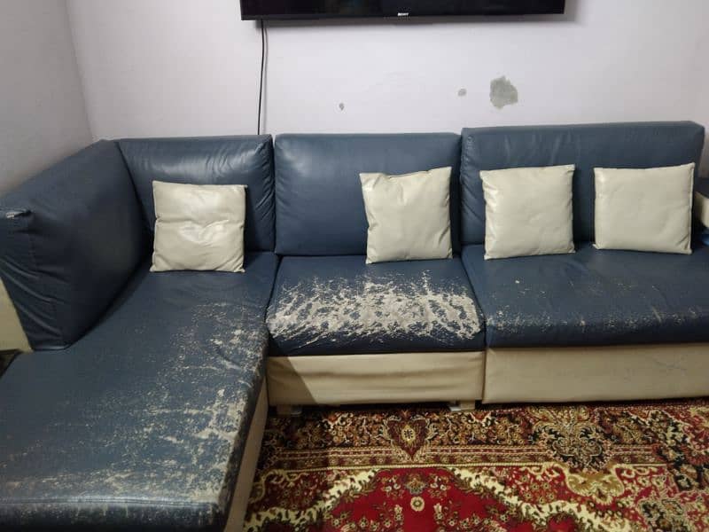 L shaped bluish grey and cream color sofa 1