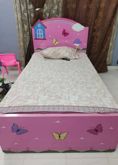 bed with mattress and cupboard