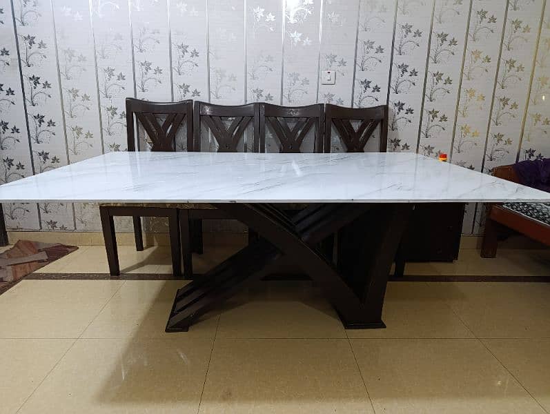 full size Dining table with 6 chairs. Glass top with marbled sheet 2