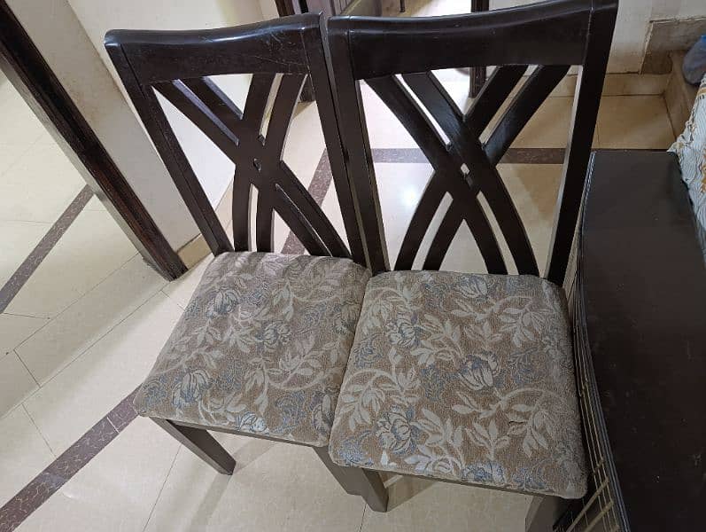 full size Dining table with 6 chairs. Glass top with marbled sheet 6