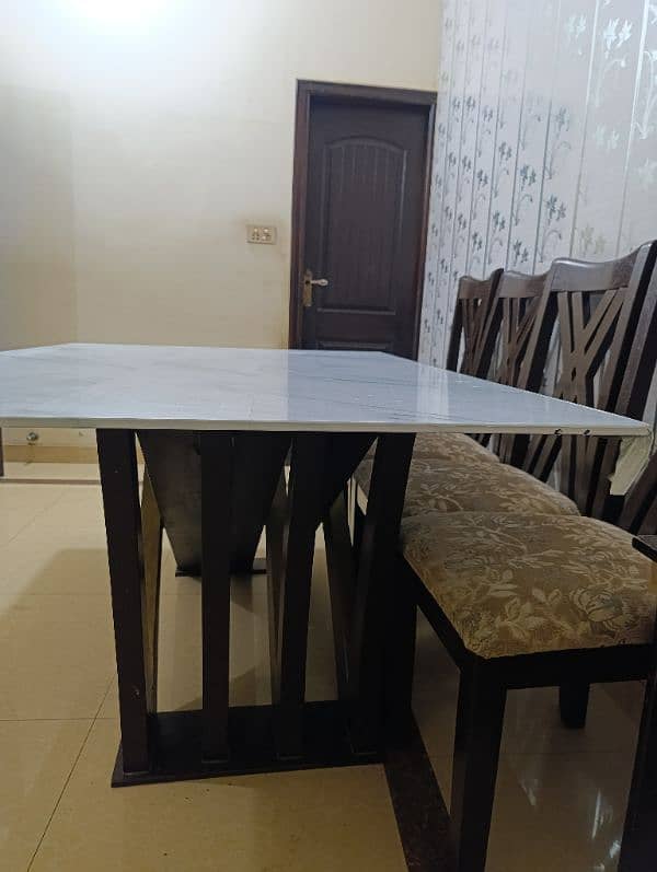 full size Dining table with 6 chairs. Glass top with marbled sheet 8