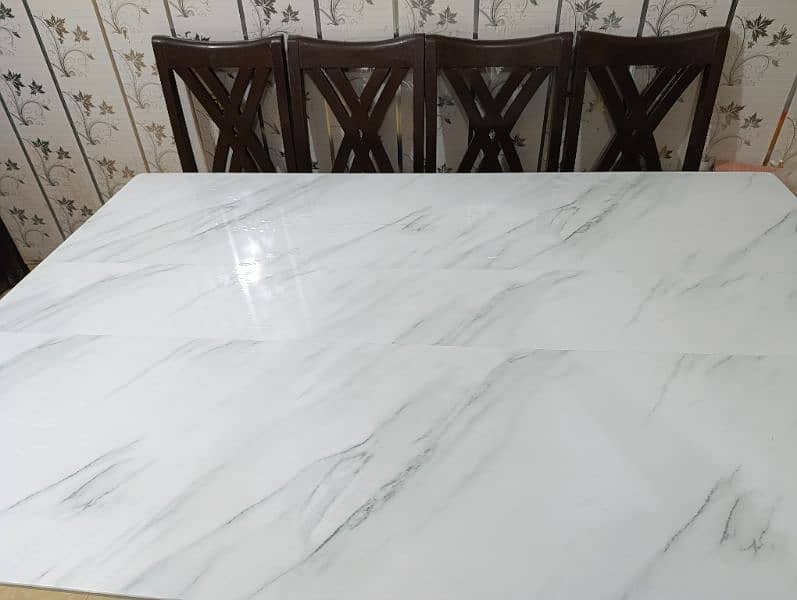 full size Dining table with 6 chairs. Glass top with marbled sheet 9