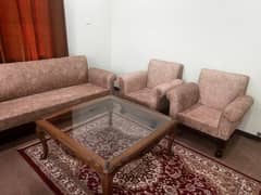 5 seater sofa set with a glass top table made of pure sheesham wood