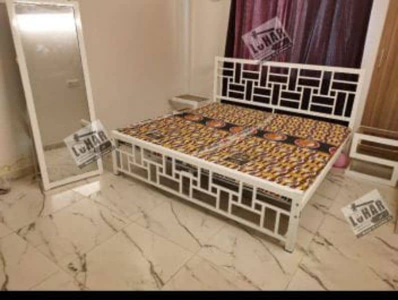 iron and steel bed with sidetables 6