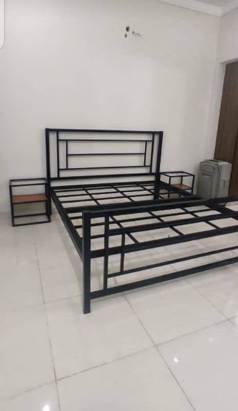 iron and steel bed with sidetables 7