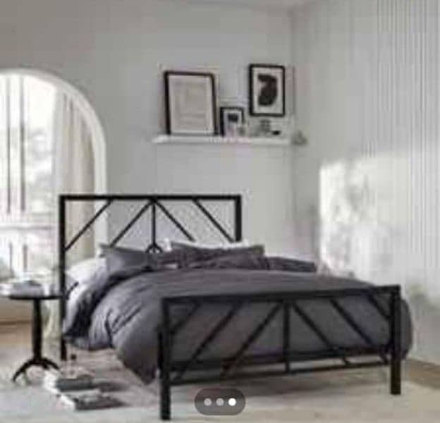 iron and steel bed with sidetables 10