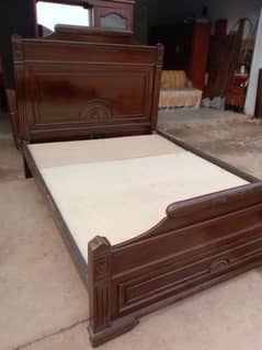 Queen size bed with a side table