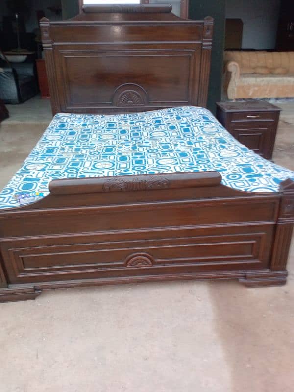 Queen size bed with a side table 2