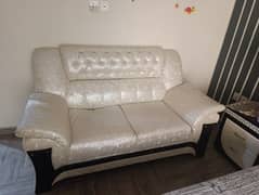 2 2 seater sofa and a table