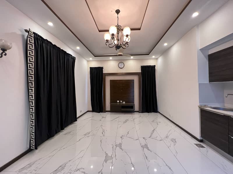 Chic 1-Kanal Fully Furnished Home With 5 Beds, 2 Kitchens, & More In DHA Phase 4 Block HH 9