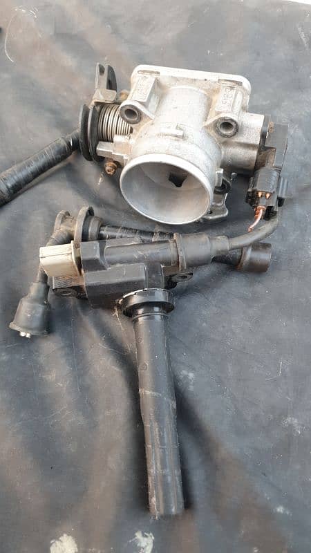 Suzuki Liana Original Throttle Body and a Coil Original Denso. 0