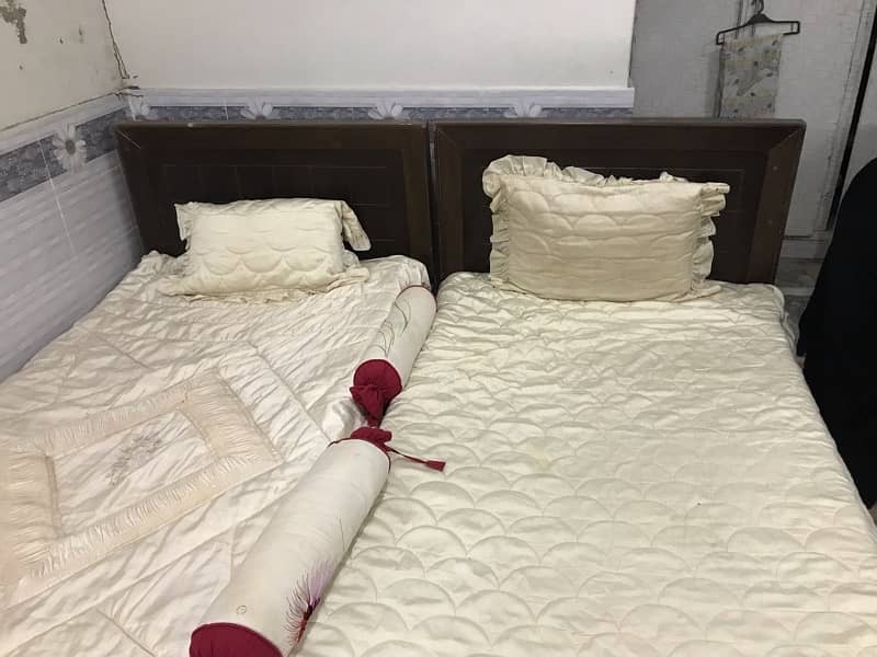 2 single beds with quality foams and bed sheets 2