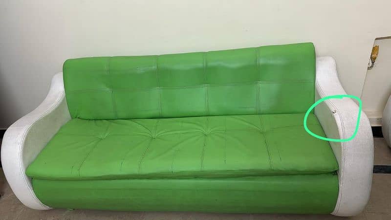 3 seater sofa in green nd white color 0