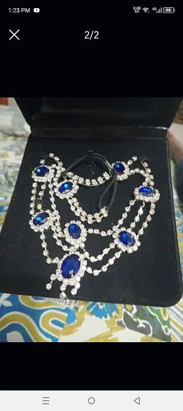 silver and blue necklace 0