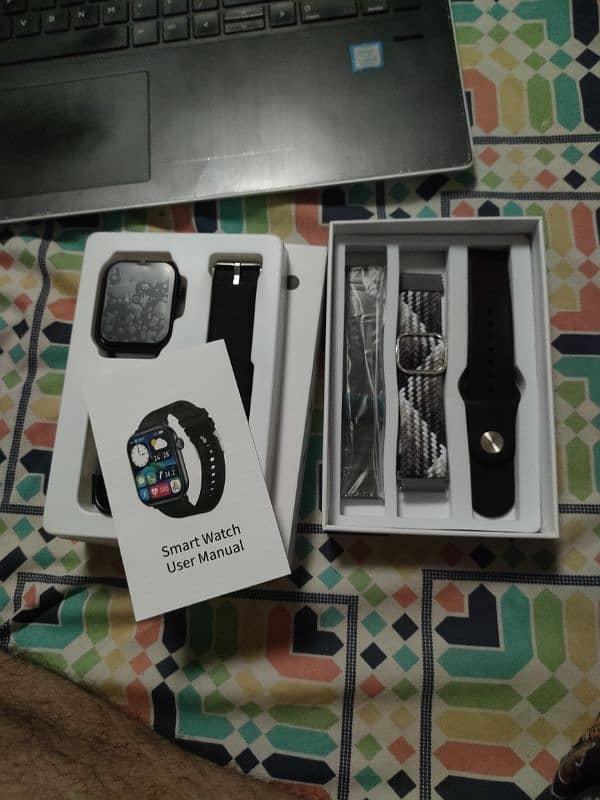 two smart watches and one fitness tracker band 4