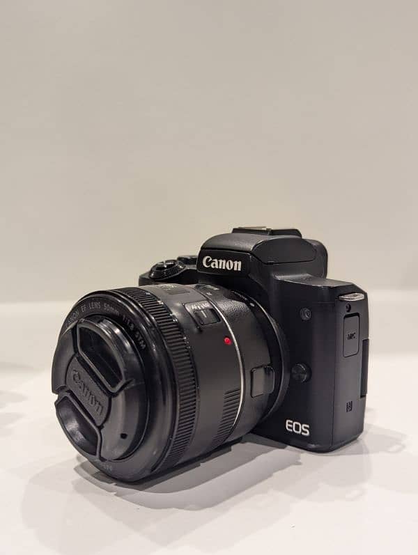 Canon EOS M50 with 50mm lens. 3