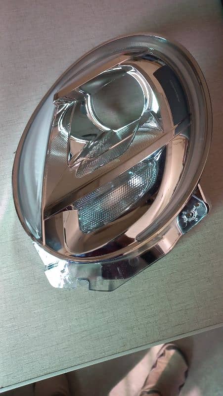 Daihatsu Cast , Headlight Chrome , Passenger Side 3