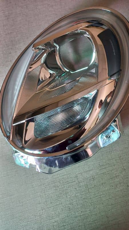 Daihatsu Cast , Headlight Chrome , Passenger Side 0