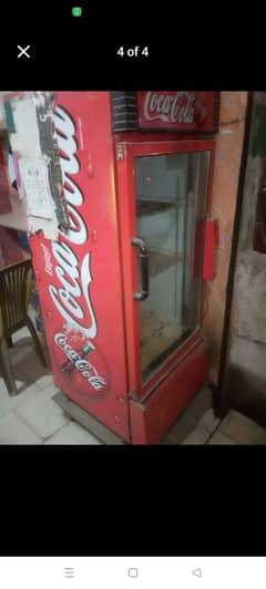 Coke Fridge & Empty Bottles Crate.