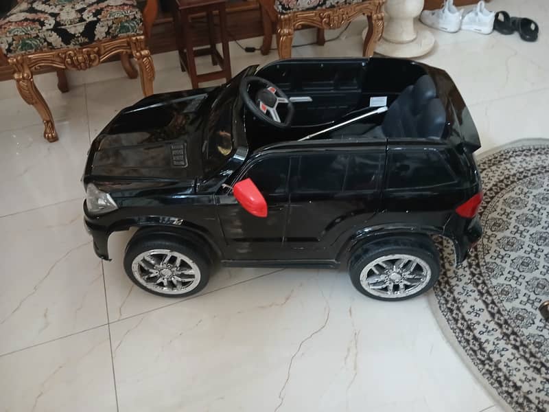 Black remote controlled landcruiser prado for kids 2