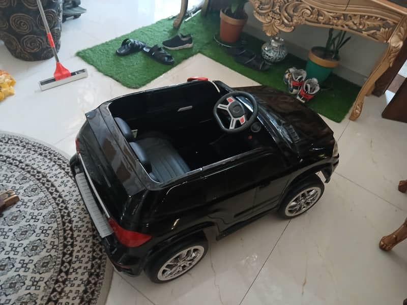 Black remote controlled landcruiser prado for kids 3