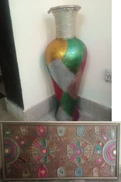 vase and wall hanging