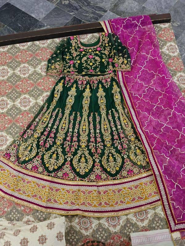 Indian hand work on bottled green lehnga. 3