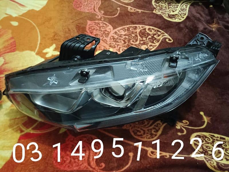 Honda civic 18 model head lights number 03340560237 0