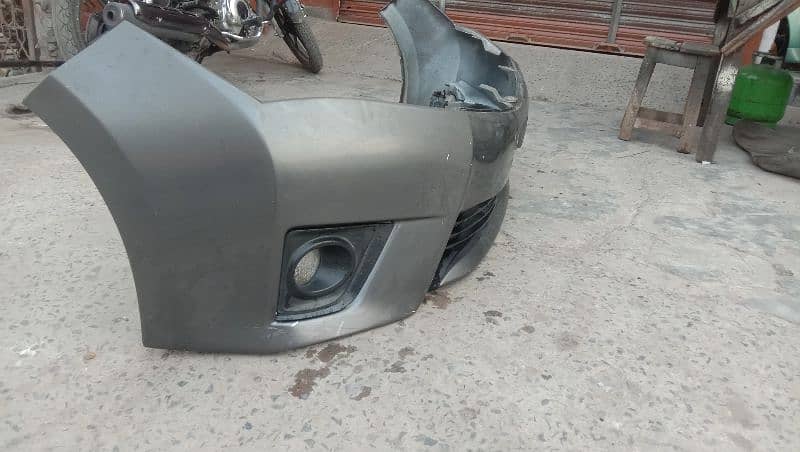 Toyota corolla 1.6 altus front bumper with fog lite holder 1