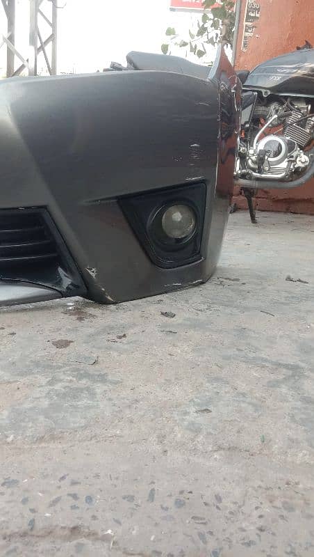 Toyota corolla 1.6 altus front bumper with fog lite holder 3