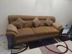 Brown sofa with brown cushion