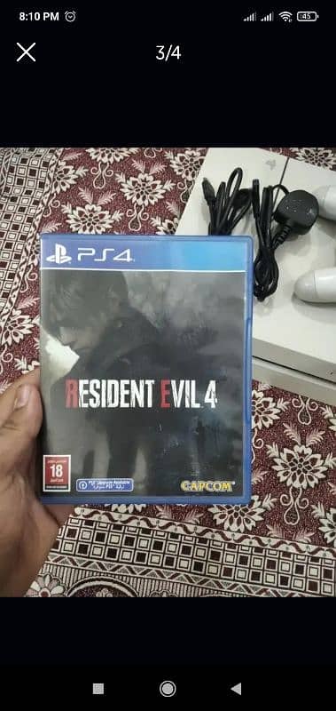 playstation 4 with cd resident evile 4 remake 2