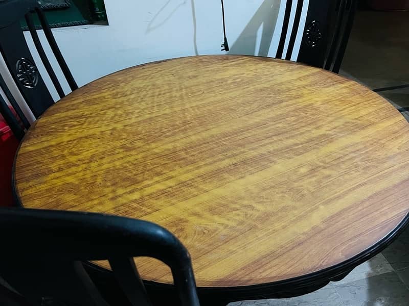 Dining table with four chairs in good condition 2