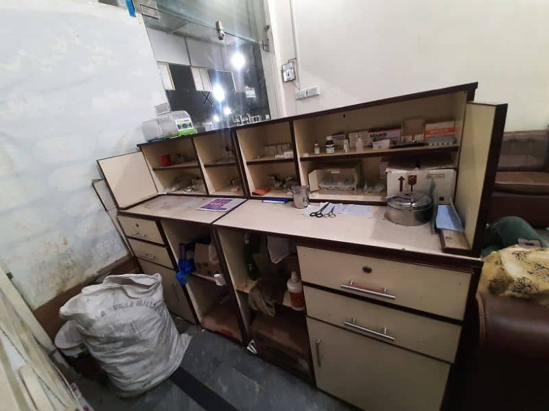 dispensary clinic table and small boxes shelves condition 100%. 1