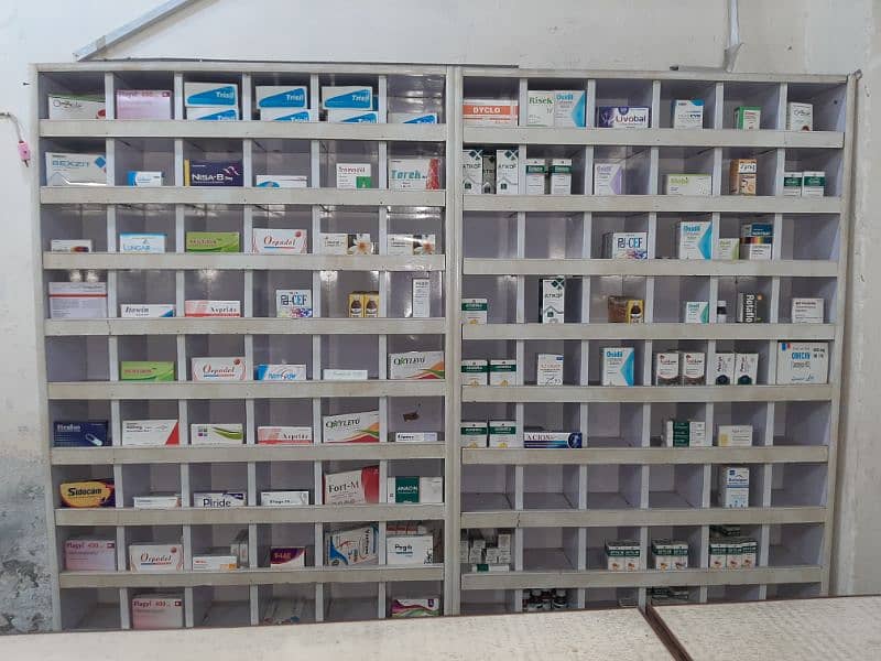 dispensary clinic table and small boxes shelves condition 100%. 3