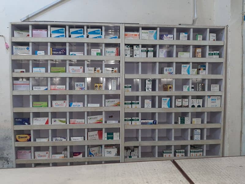 dispensary clinic table and small boxes shelves condition 100%. 5