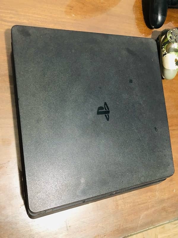 PS4 Slim edition 1TB with 2 original Controllers 3