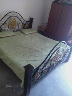 king size iron bed along spring mattress for sale