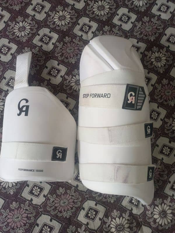 cricket pads and thigh pads and helmet 0