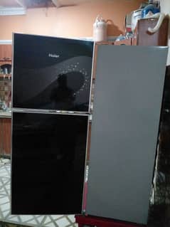 haier refrigerator black glass door new condction available