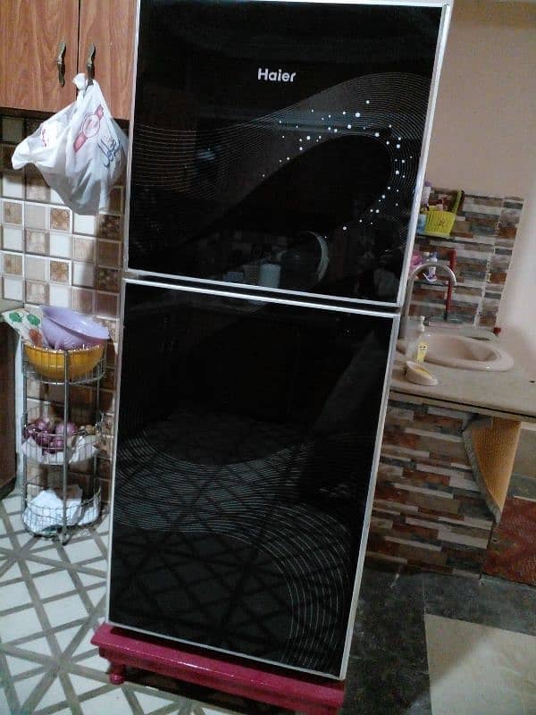 haier refrigerator black glass door new condction available 2