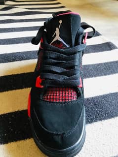 Jordan 4 Retro “Red Thunder”