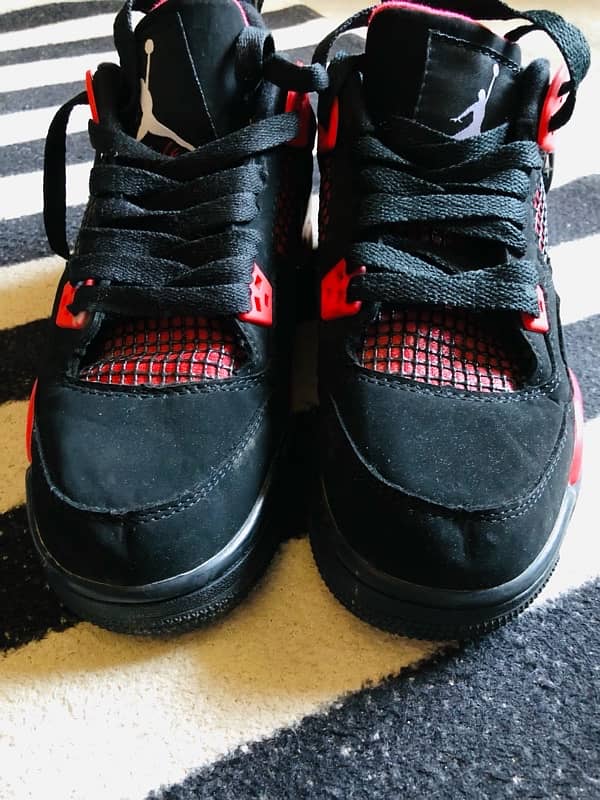 Jordan 4 Retro “Red Thunder” 9