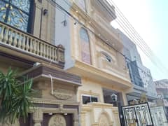 5 marla brand new triple story house for sale in Johar town Lahore.