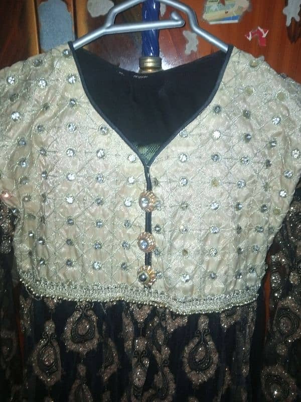 Black and golden clr Net fancy frock 1