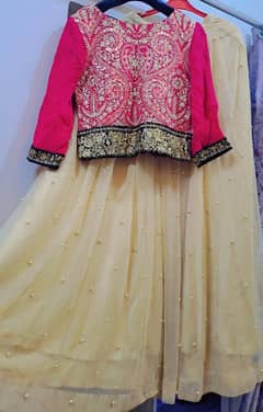 skin golden lehnga with pink blouse